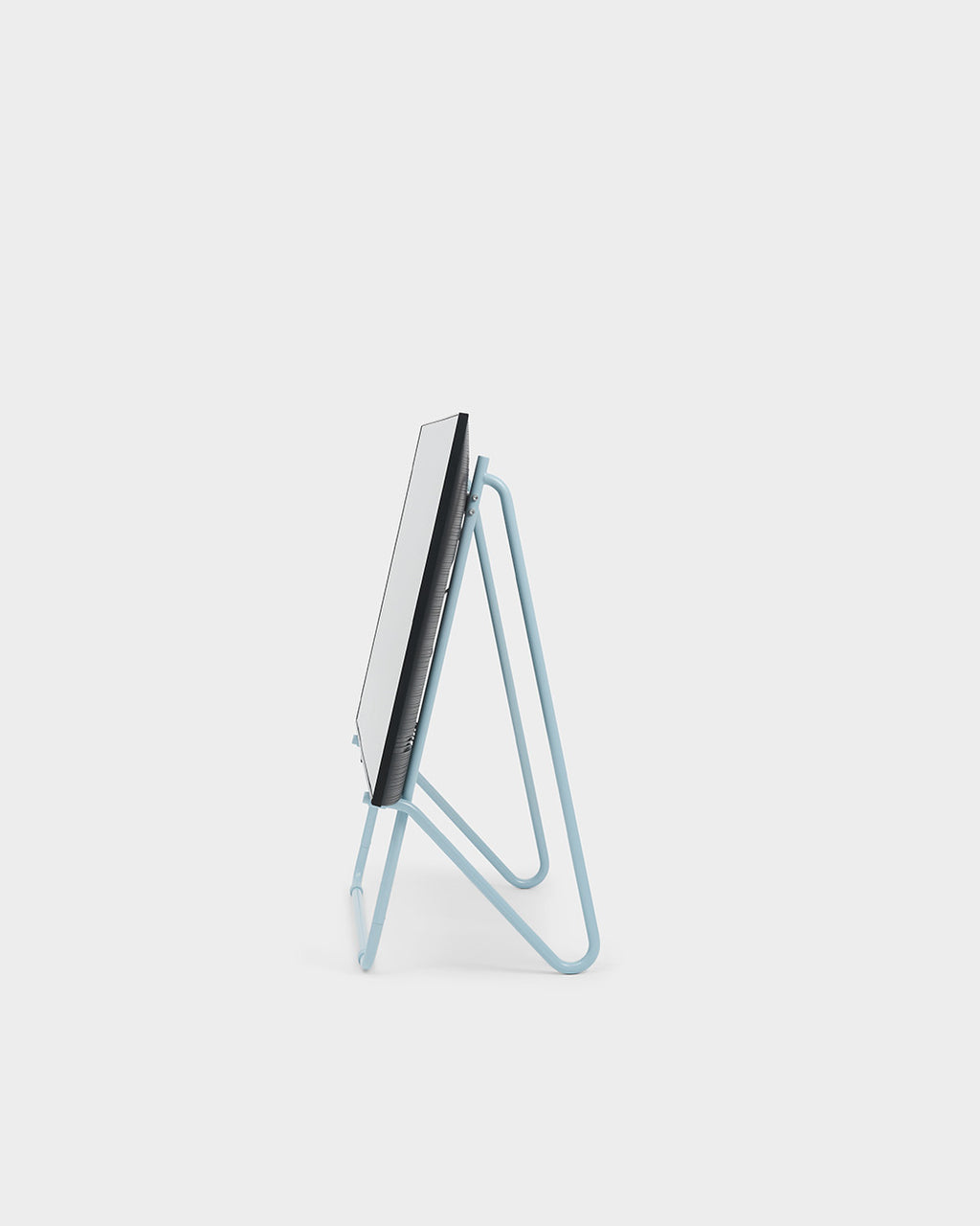 Side profile of Bloom in Powder Blue Stands Low easel-style display stand holding a flat panel, studio packshot