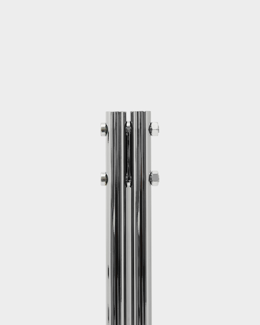 Close-up of the Moon in Chrome stand's split column with hex bolt hardware, studio packshot on white