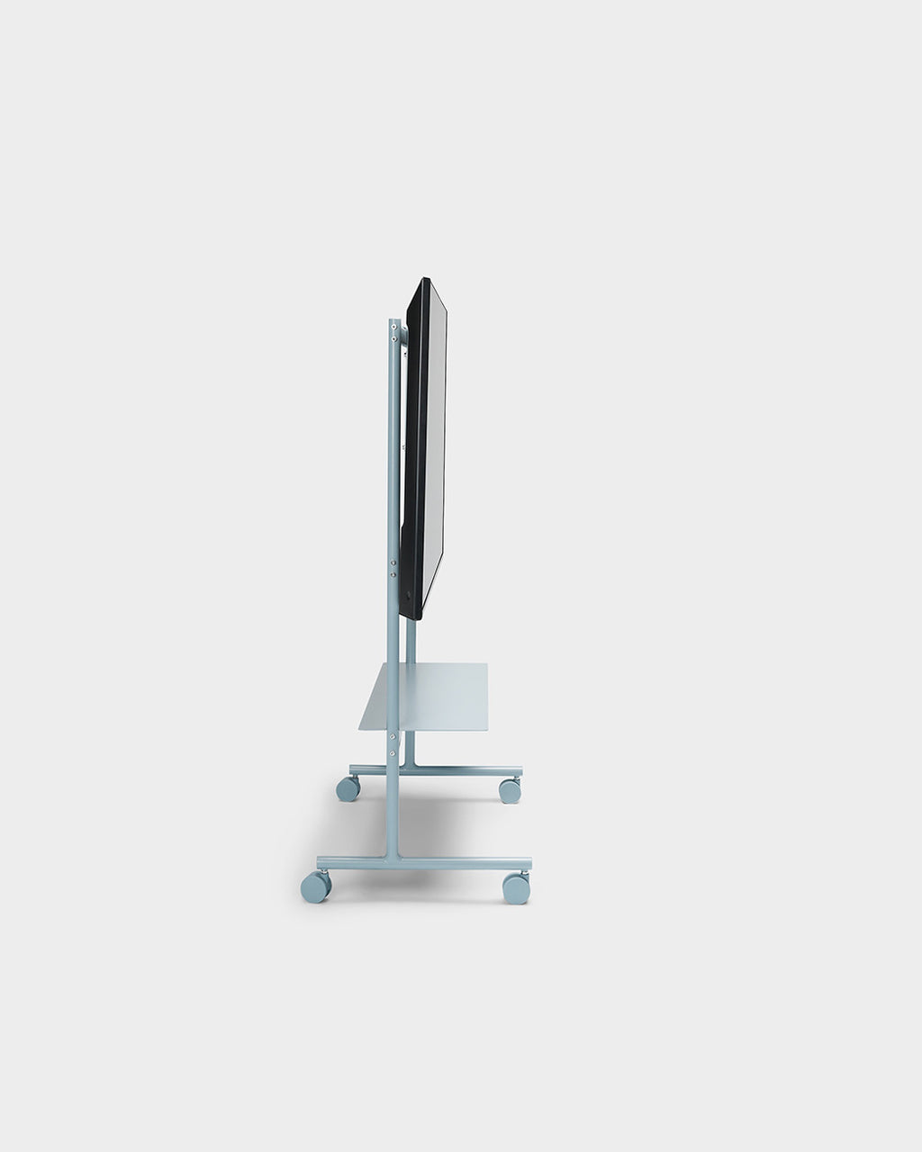 Side profile studio shot of the Rover stand in Powder Blue with mounted TV, shelf and locking caster wheels